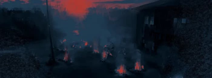 Un village en flammes vu de loin
